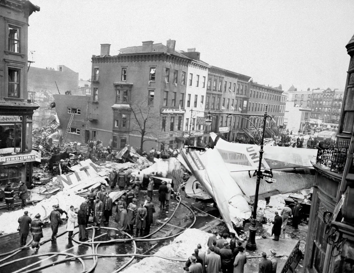 A Car Burns Under The Tail Of The United Airlines Dc-8 &Amp;Amp; Twa Super Constellation After Two Airplanes Collided Over Foggy New York Harbor And Crashed In Brooklyn'S Park Slope Area, 1960.