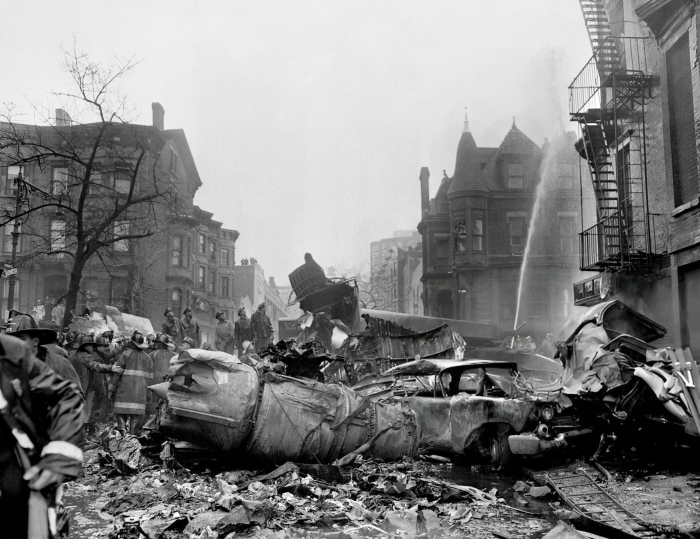One Of The Jet Engines Of The United Airlines Craft Lies Next To A Gutted Car At Seventh Ave. And Sterling Place, Brooklyn, After The United Airlines Dc-8 &Amp;Amp; Twa Super Constellation Aviation Accident, 1960.