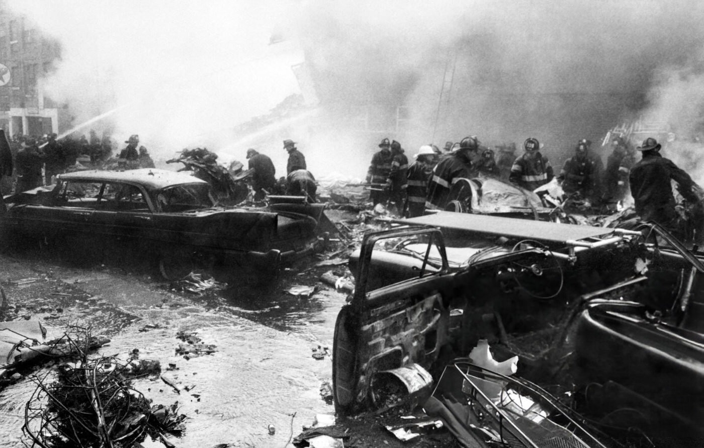 Firefighters Search For Victims At The Scene Of The Plane Crash In Brooklyn After A Collision Between Two Airliners, United Airlines Flight 826 And Trans World Airlines Flight 266 Over New York City, 1960.
