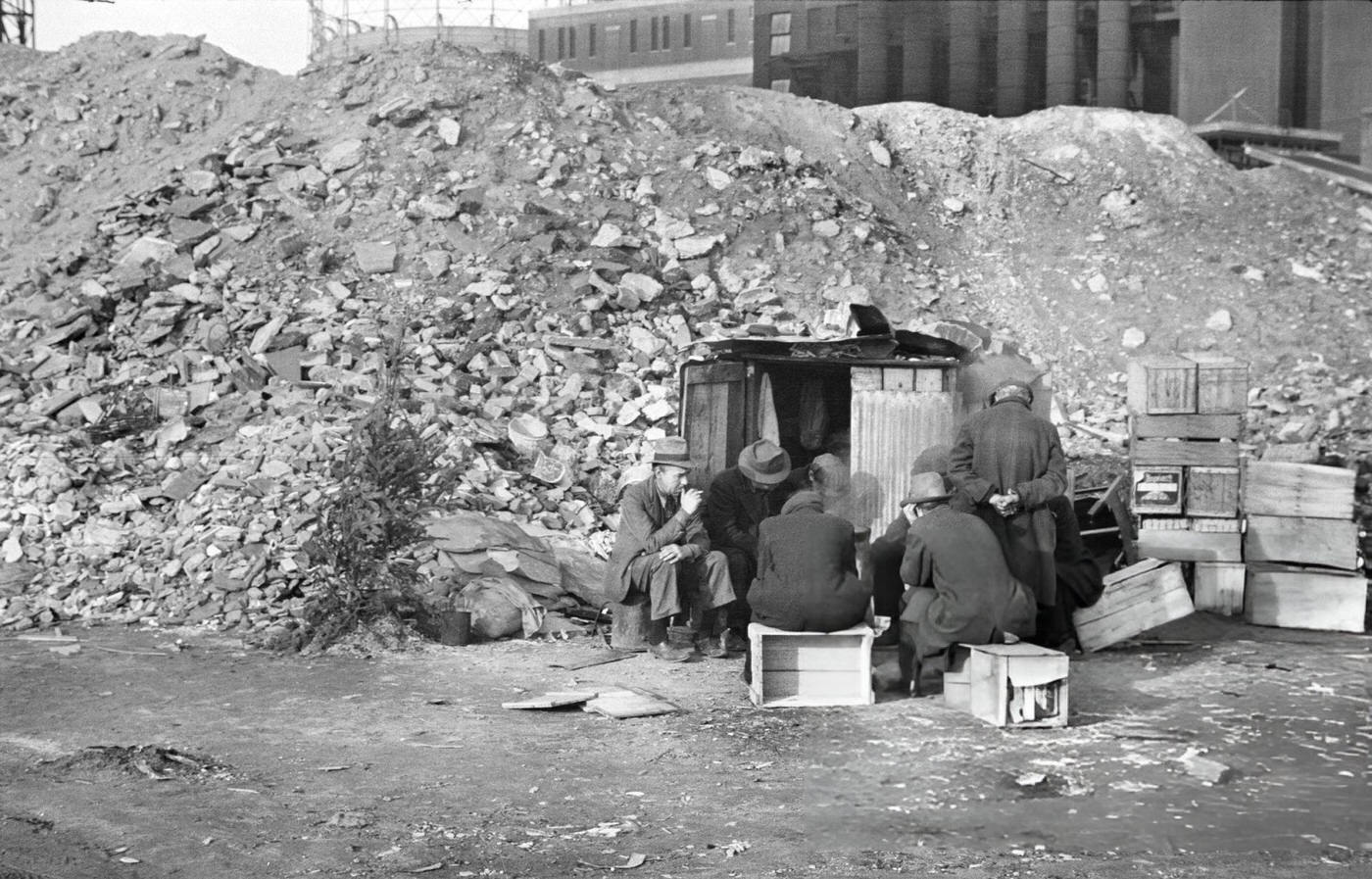 Unemployed Workers In Front Of Shack Next To Pile Of Rubble, East 12Th Street, 1938.