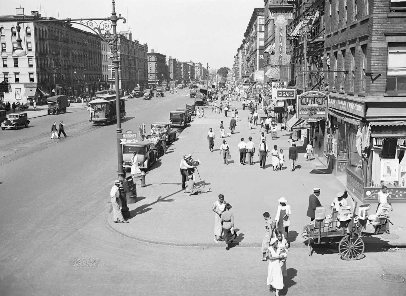 Businesses Line Lenox Avenue, Crowded With Pedestrians In Harlem.