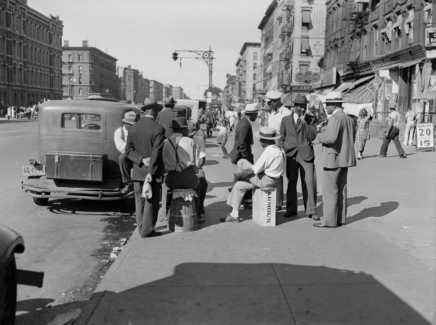 Men Conversing On A Sidewalk On Lenox Avenue In Harlem.