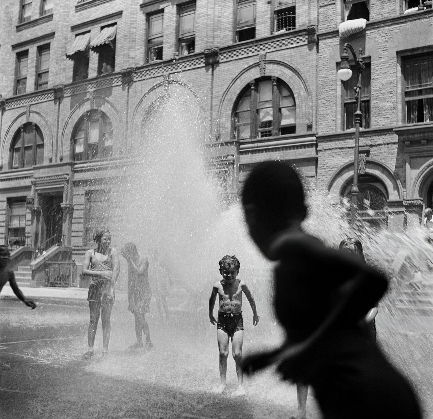 Children Playing In Fire Hydrant Water.