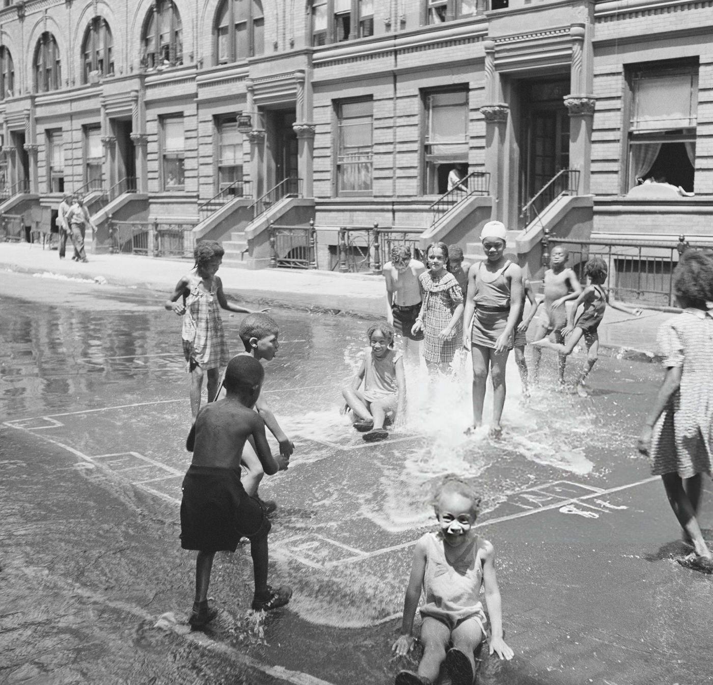 Children Playing In Fire Hydrant Water.