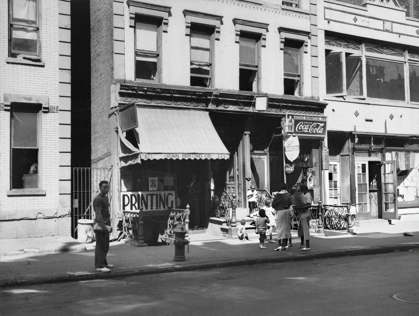 New Yorkers Outside A Printing Shop In Harlem, 1935.