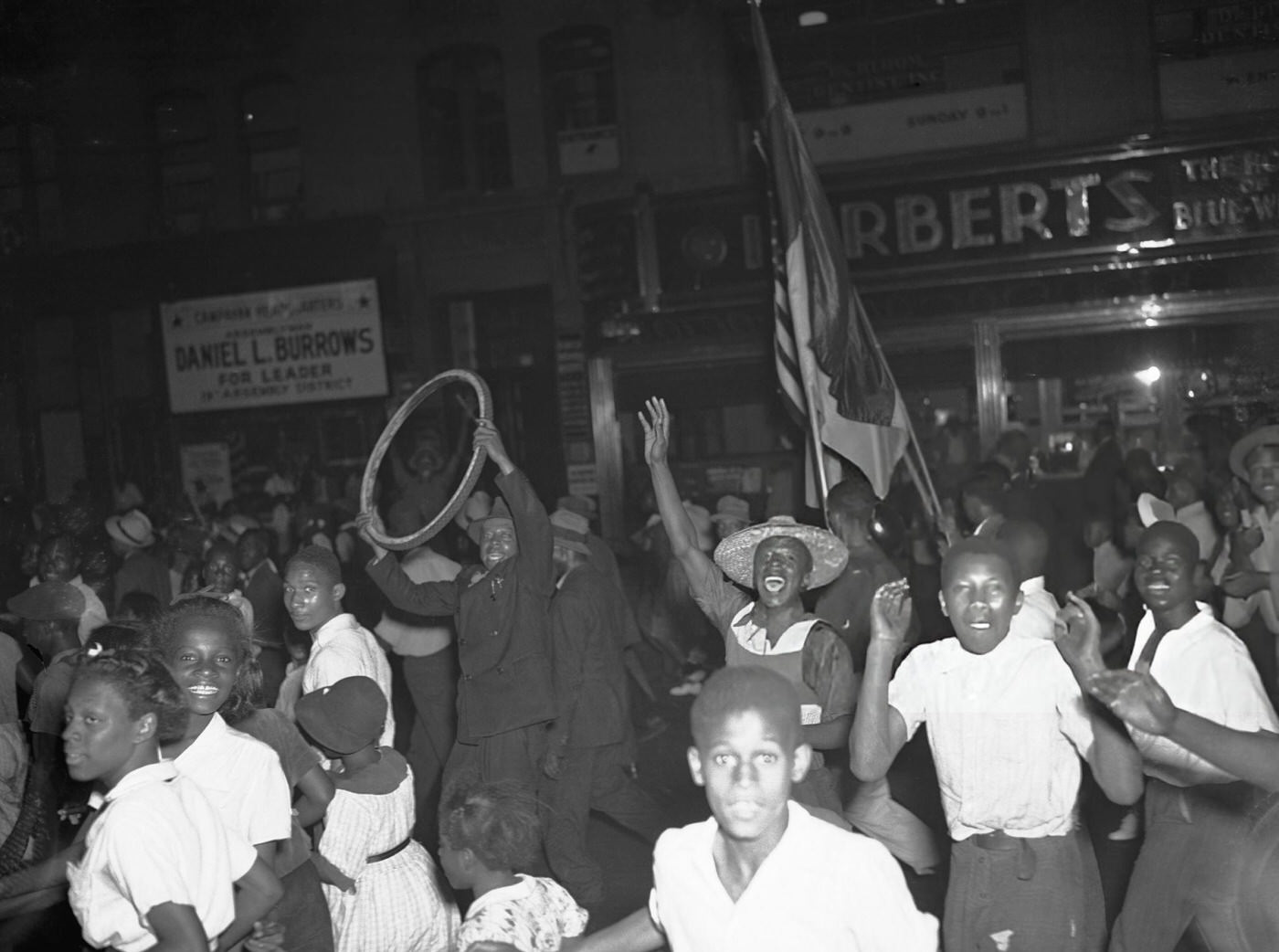People Celebrating Joe Louis' Victory In Harlem.