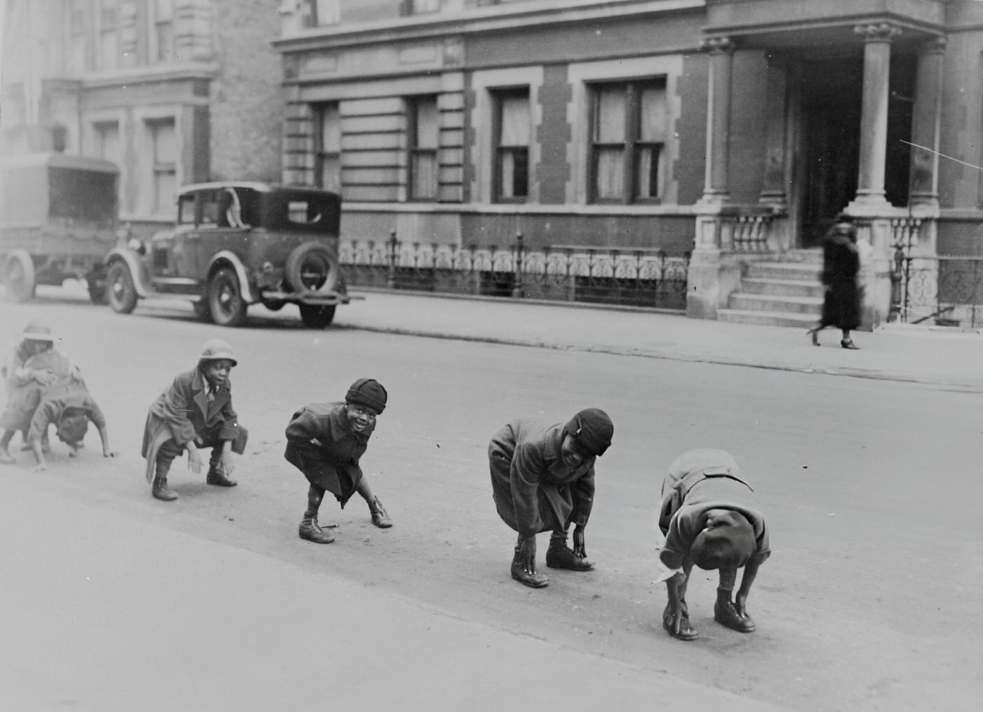 Children Playing Leapfrog In A Street In Harlem.