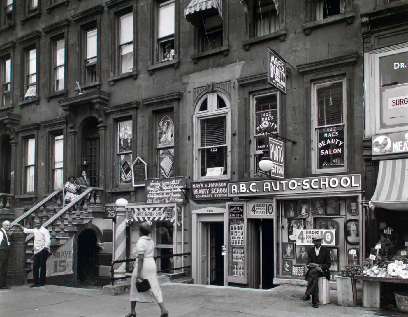 Woman Walking In Harlem, 422-424 Lenox Avenue, 1938.