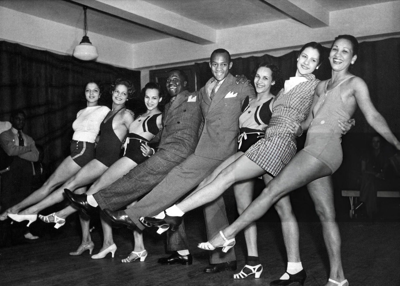 Jesse Owens Dancing With Bill Robinson And Female Dancers In The Cotton Club.
