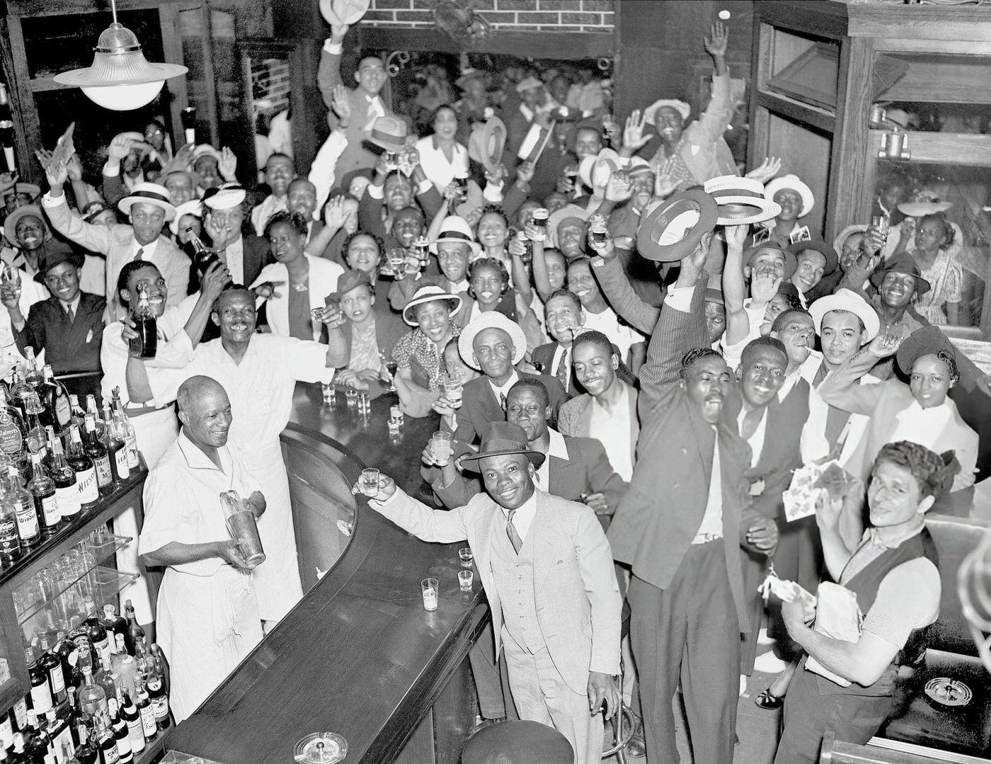 Harlem Residents Raise A Toast After Joe Louis' Victory Over Max Schmeling.