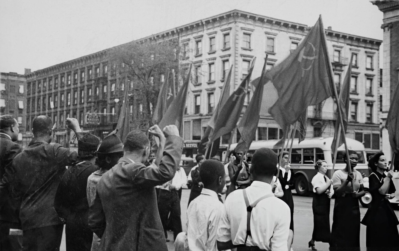 Women Carry Flags At A Communist Demonstration In Harlem, 1935.