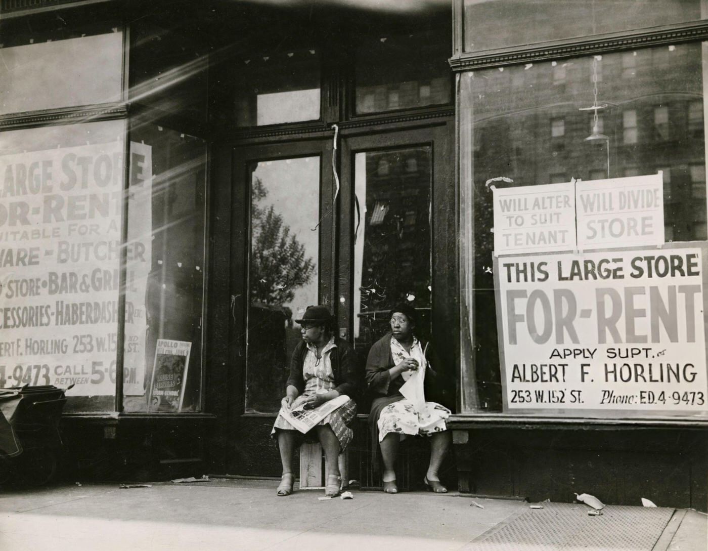 Two Women Sitting In Doorway Of Empty Storefront In Harlem, 1930S.