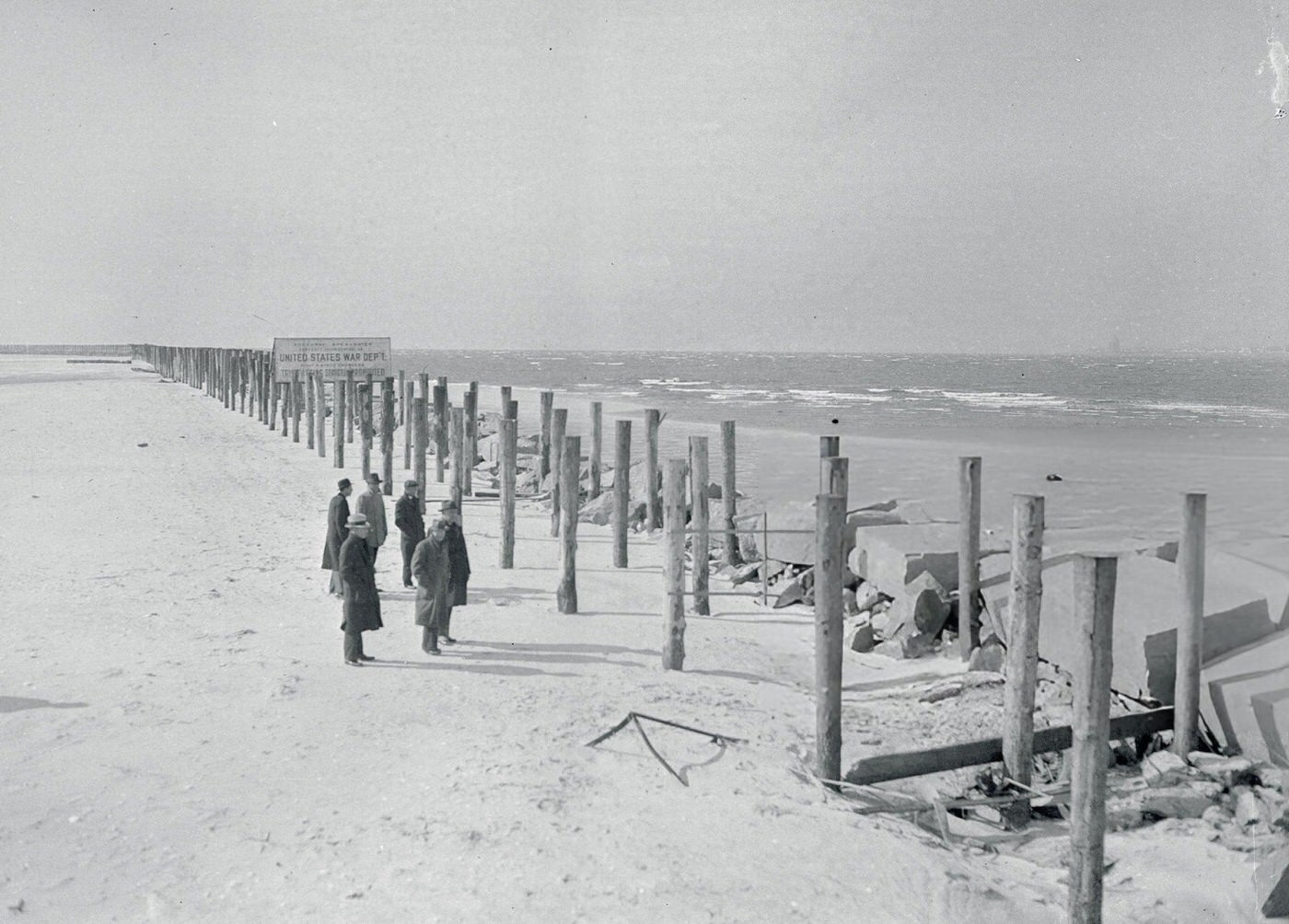 A jetty to keep sand out of the harbor nears completion at Rockaway Point, Jamaica Bay, 1930s.