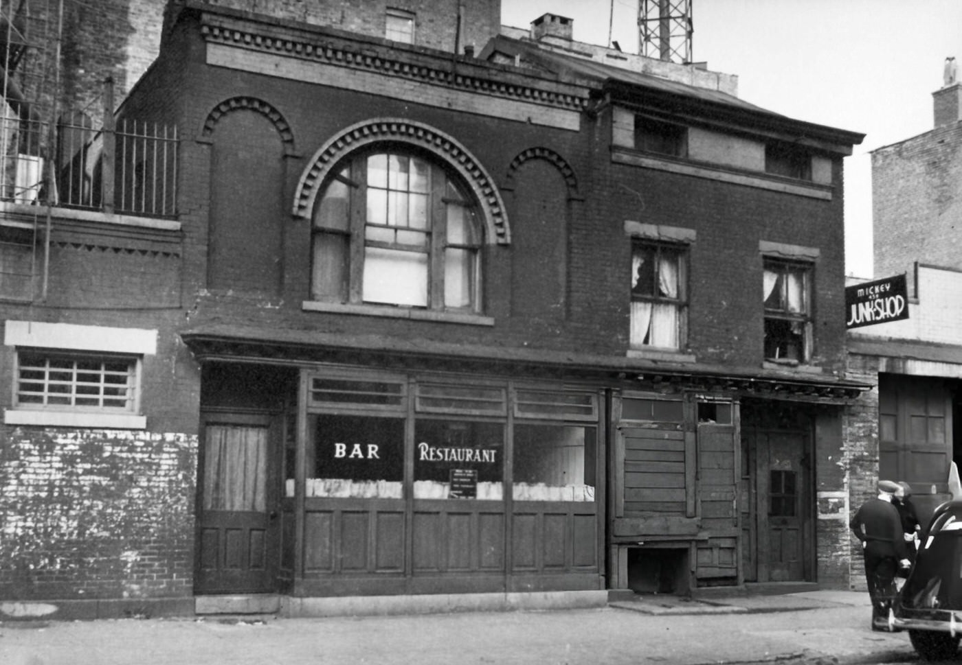Two Story Bar And Restaurant, Small House And At Far Right, A Junk Shop. West 18Th Street, Nos. 461-463, Manhattan, 1938