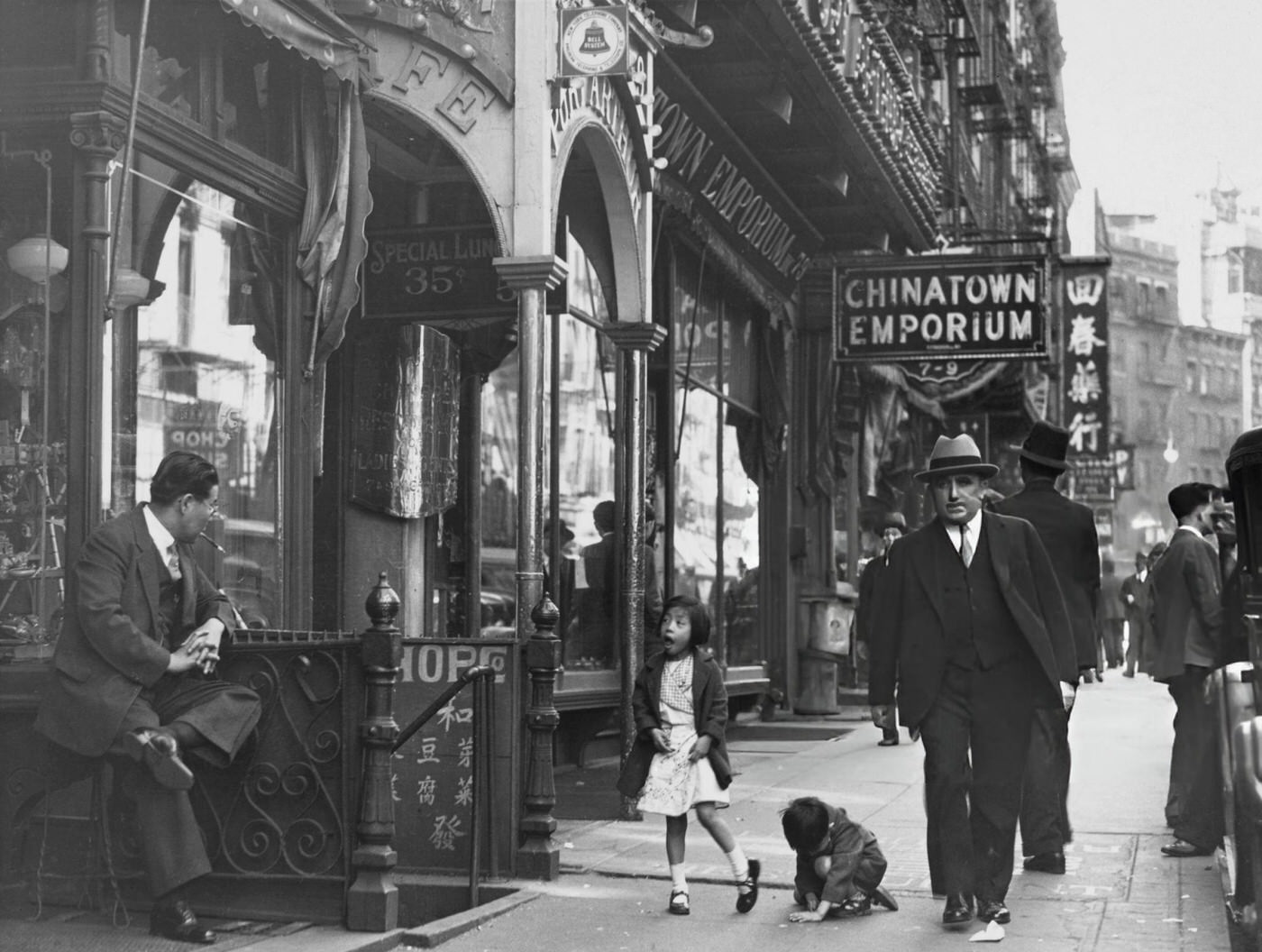 Pedestrians Outside The Port Arthur Restaurant On Mott Street In The Chinatown Neighborhood Of Lower Manhattan, Circa 1935.