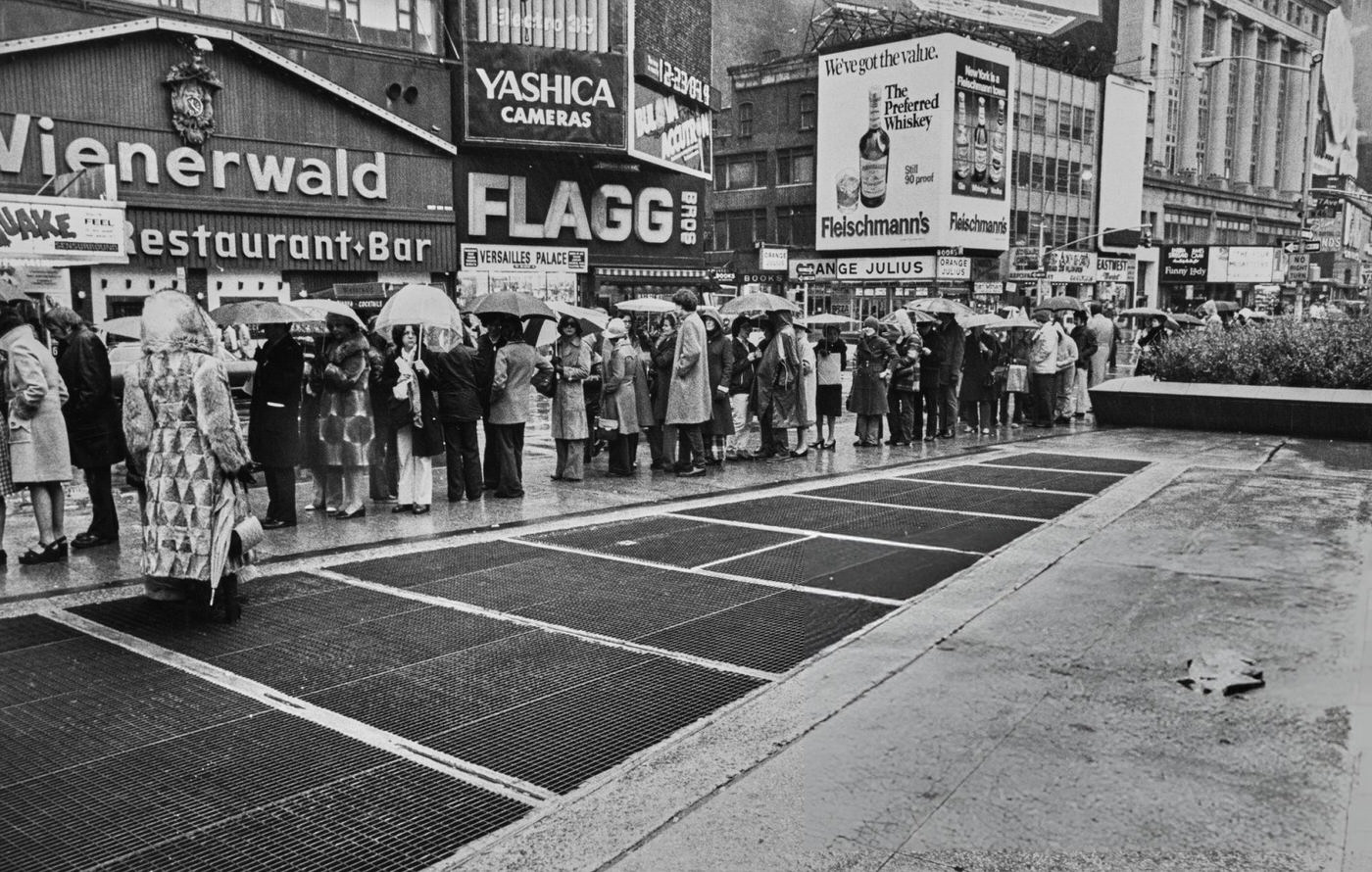 People Waiting In Line On Seventh Avenue, With A Wienerwald Restaurant In The Background, In Midtown Manhattan, 1965.
