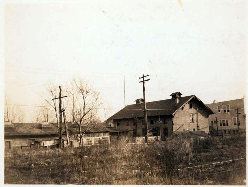 Frame Peaked Roof Building And Stuccoed Low Building Alongside The Manhattan Beach Rail Road Tracks On The West Side Of West End Avenue, Brighton Beach, 1923.