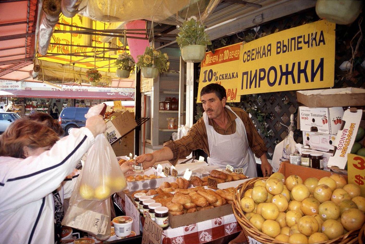 A Russian-Speaking Shopper Makes A Purchase In Brighton Beach, Brooklyn, 2005.