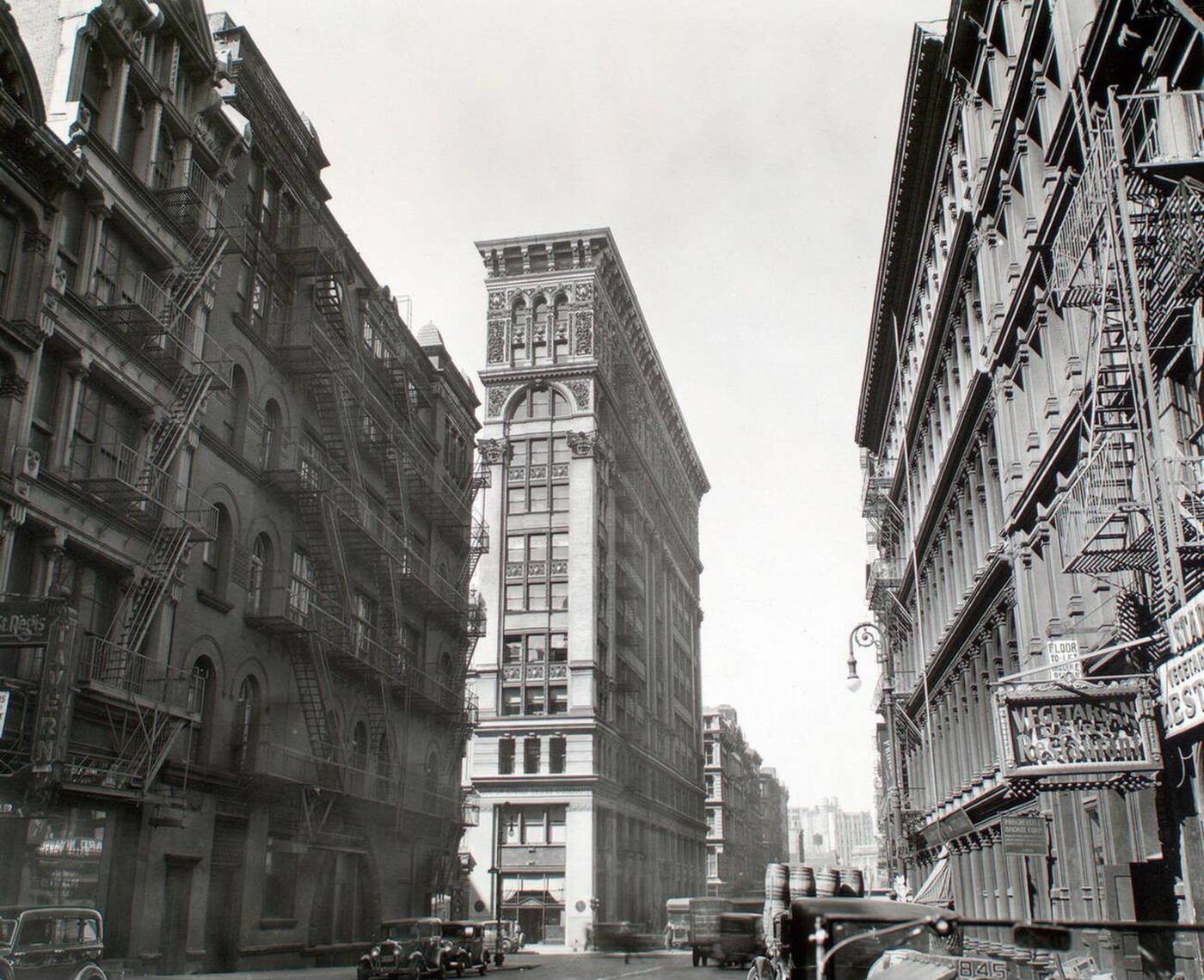 View Looking Down Broadway, Ornate Bank Of Sicily Trust Near Center, Vegetarian Restaurant, Broadway Near Broome Street, Manhattan, Ca. 1935.