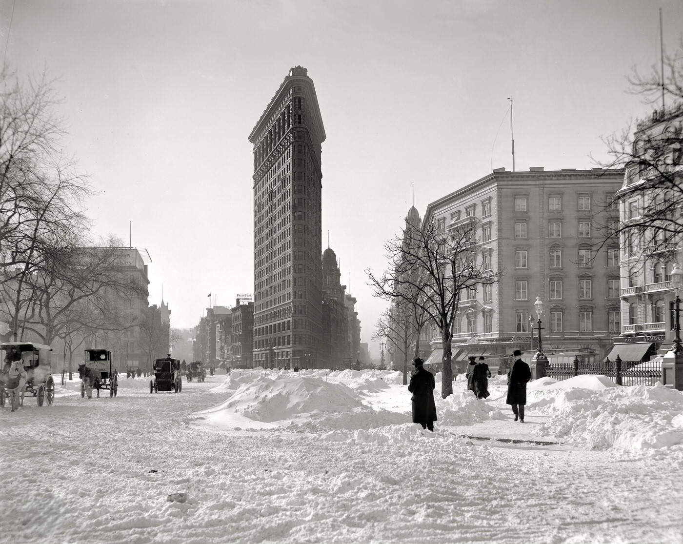 Flatiron Building Corner After A Snowstorm, New York, Circa 1905.