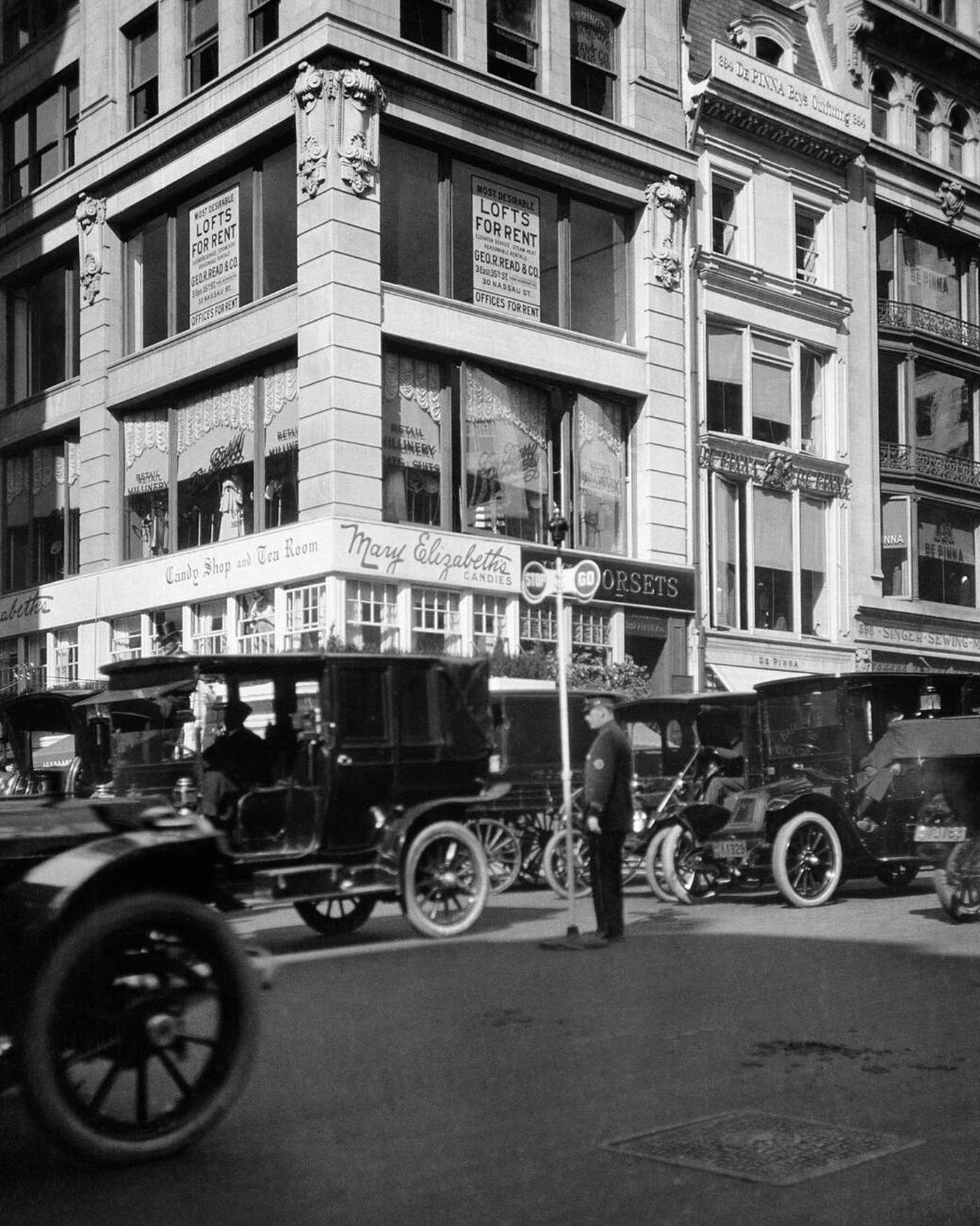 A Policeman Controls Traffic On Fifth Avenue Using A Hand-Operated Semaphore Signal, New York City, 1910S.