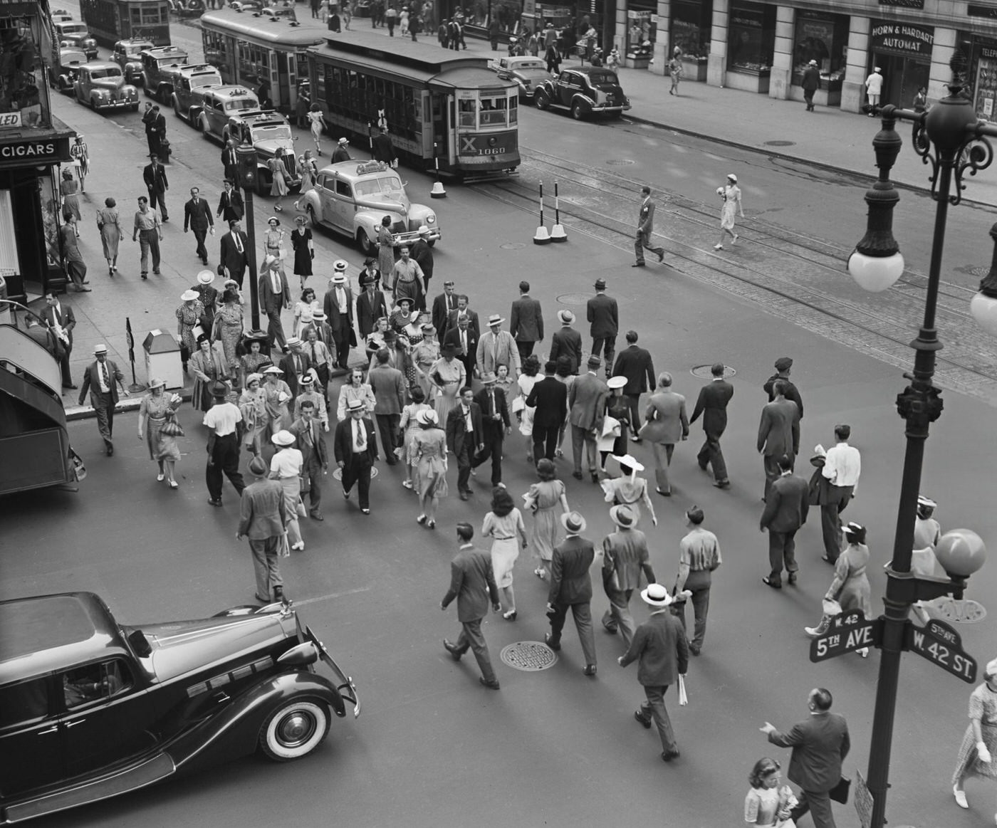 Pedestrians Crossing The Road At 5Th Avenue And West 42Nd Street, 1940.