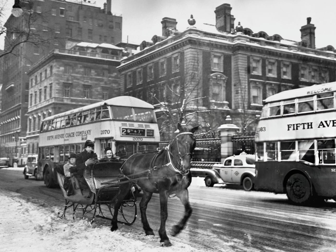 Horse-Drawn Sleigh And A Double-Decker Bus On Fifth Avenue And 90Th Street, 1941.