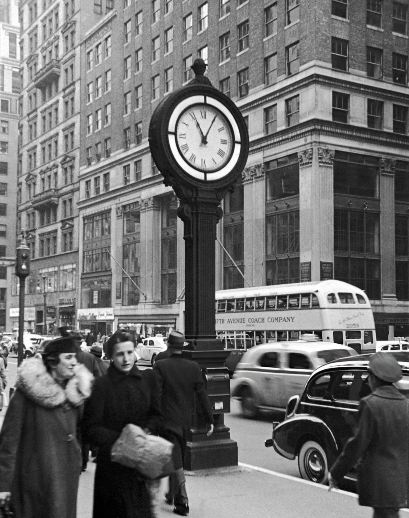 Clock On Fifth Avenue With Pedestrians And Traffic, 1940S.