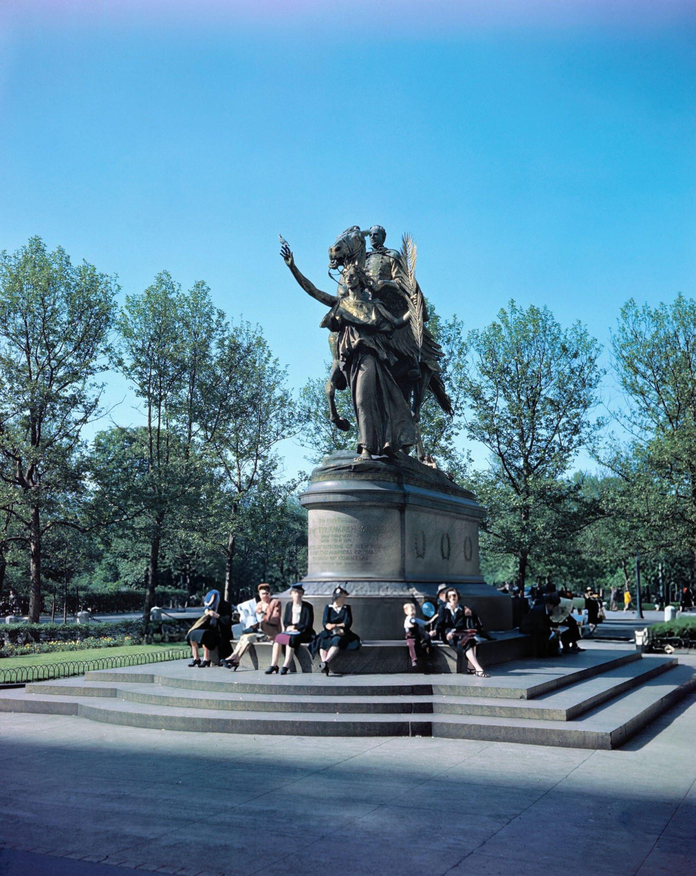 New Yorkers Sitting On Steps Of Monument