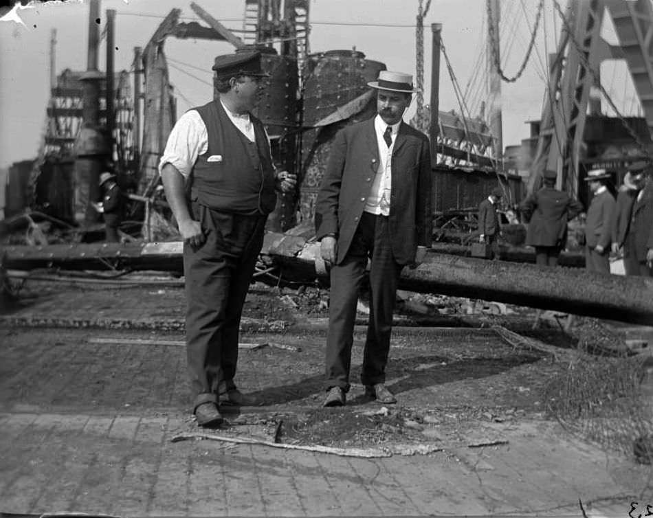 Two Men Standing On The Wreckage Of The General Slocum, North Brother Island, 1904.