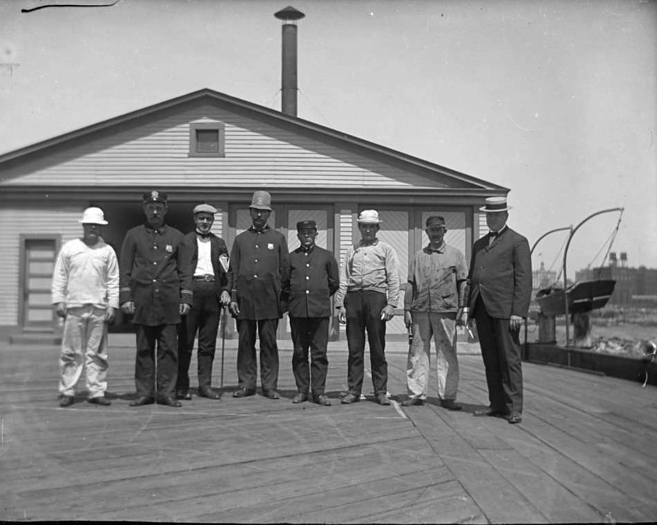 Eight Men On A Pier In The Aftermath Of The General Slocum Disaster, 1904.