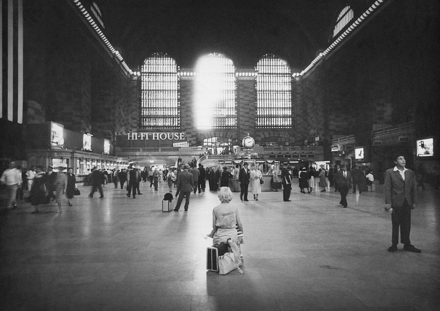 Woman Sitting On Luggage, Main Concourse, Grand Central Terminal, New York City, September 1958.