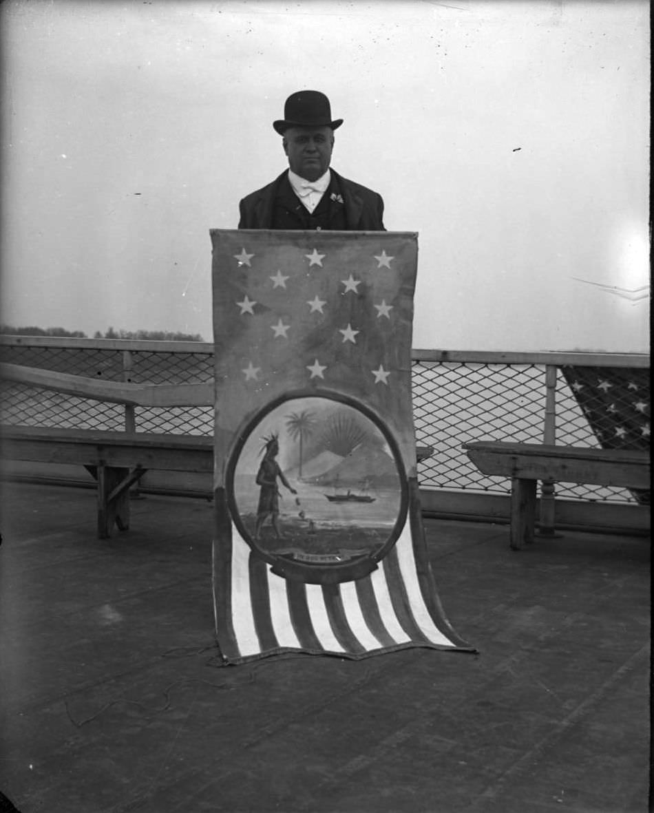 Rep. Stephen M. Sparkman Holding Coat Of Arms For His State On The Deck Of The 'Fulton Market' During The Congressional Rivers &Amp;Amp; Harbors Committee Visit, 1903.