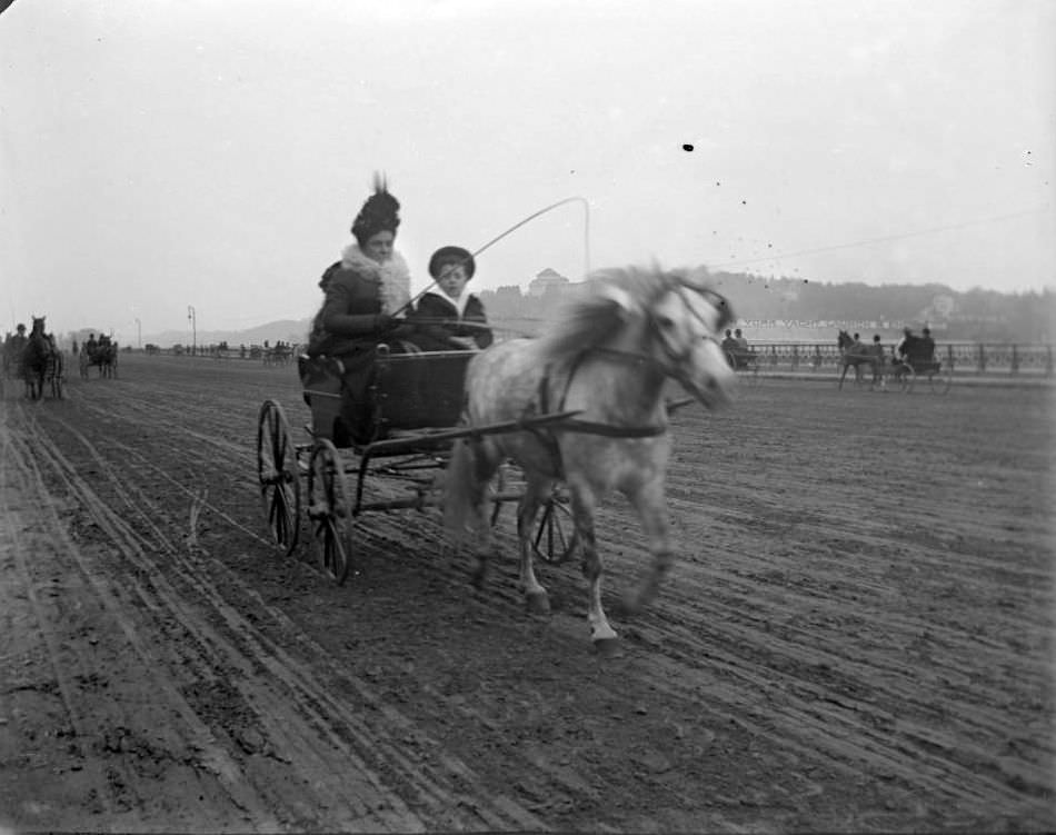 Woman And Little Boy On The Speedway, Ca. 1899.