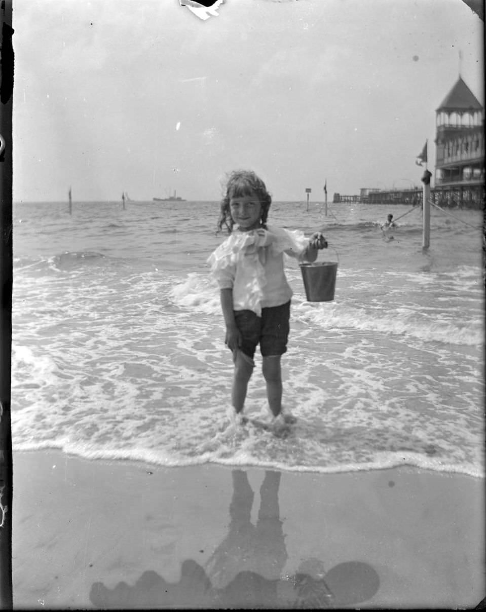 Georgie Stonebridge On The Beach Holding A Pail, Coney Island, Brooklyn, 1903.