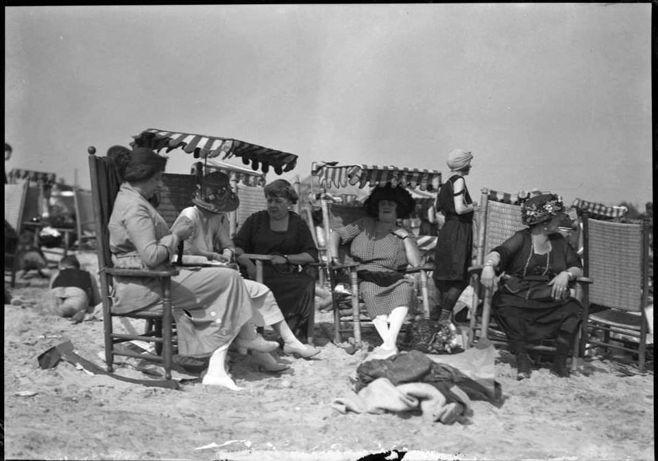 Group Of Women In Dresses Seated On Brighton Beach, Brooklyn, Ca. 1920.