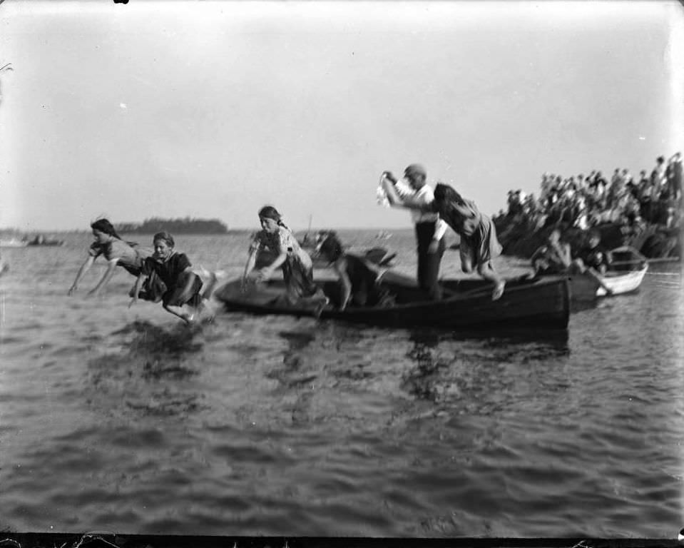 Girls Jumping Off A Canoe At Orchard Beach, Bronx, 1909.