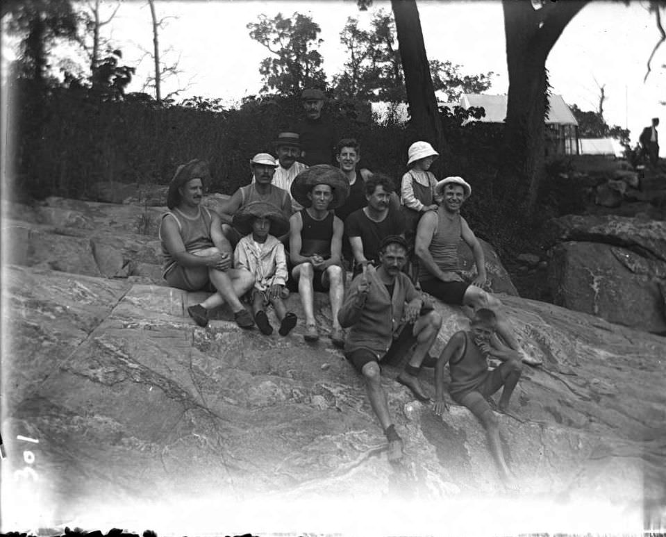 Group Of Men And Boys On A Rock On The Beach At Orchard Beach, Bronx, 1910.