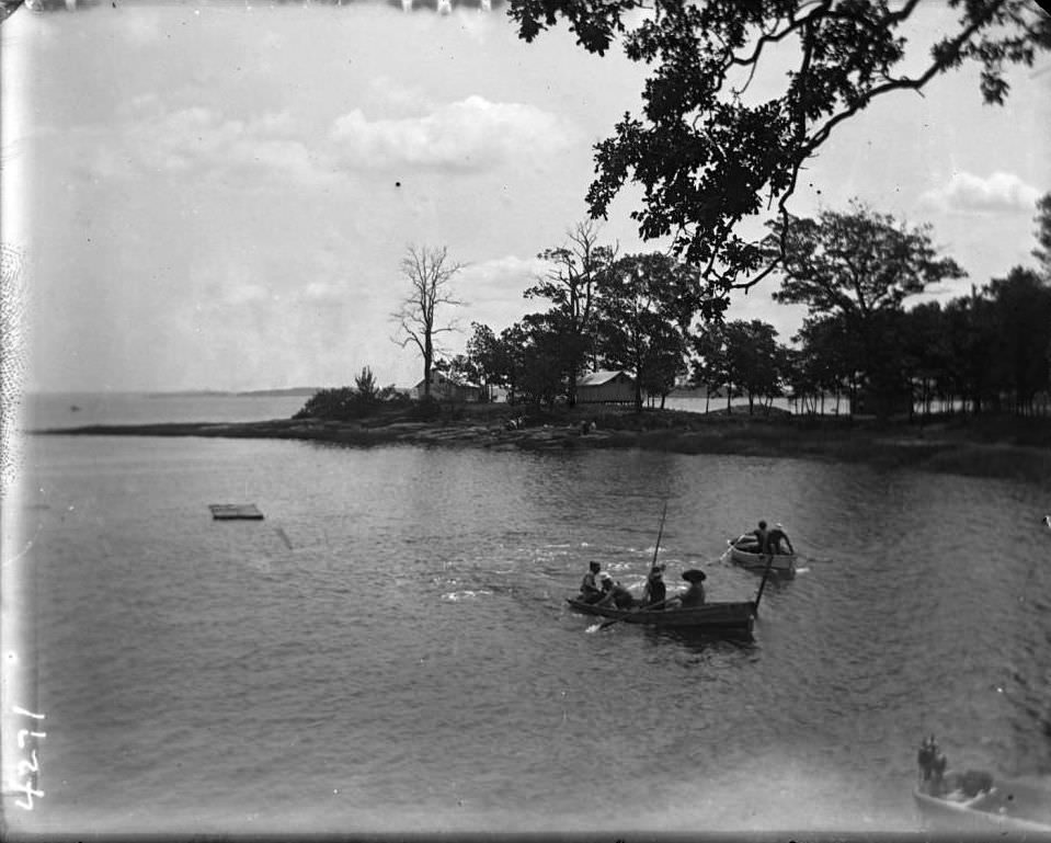 Boats In An Inlet, With Tents Beyond, Orchard Beach, Bronx, 1910.