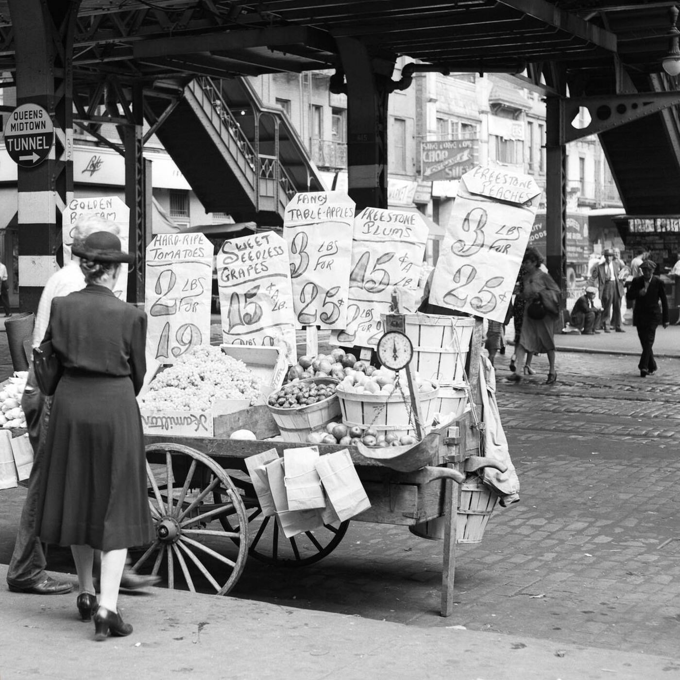 Woman Shopping For Vegetables At Street Vendor Push Cart, 59Th Street Third Avenue Under El Station, New York City, 1930S-1940S.
