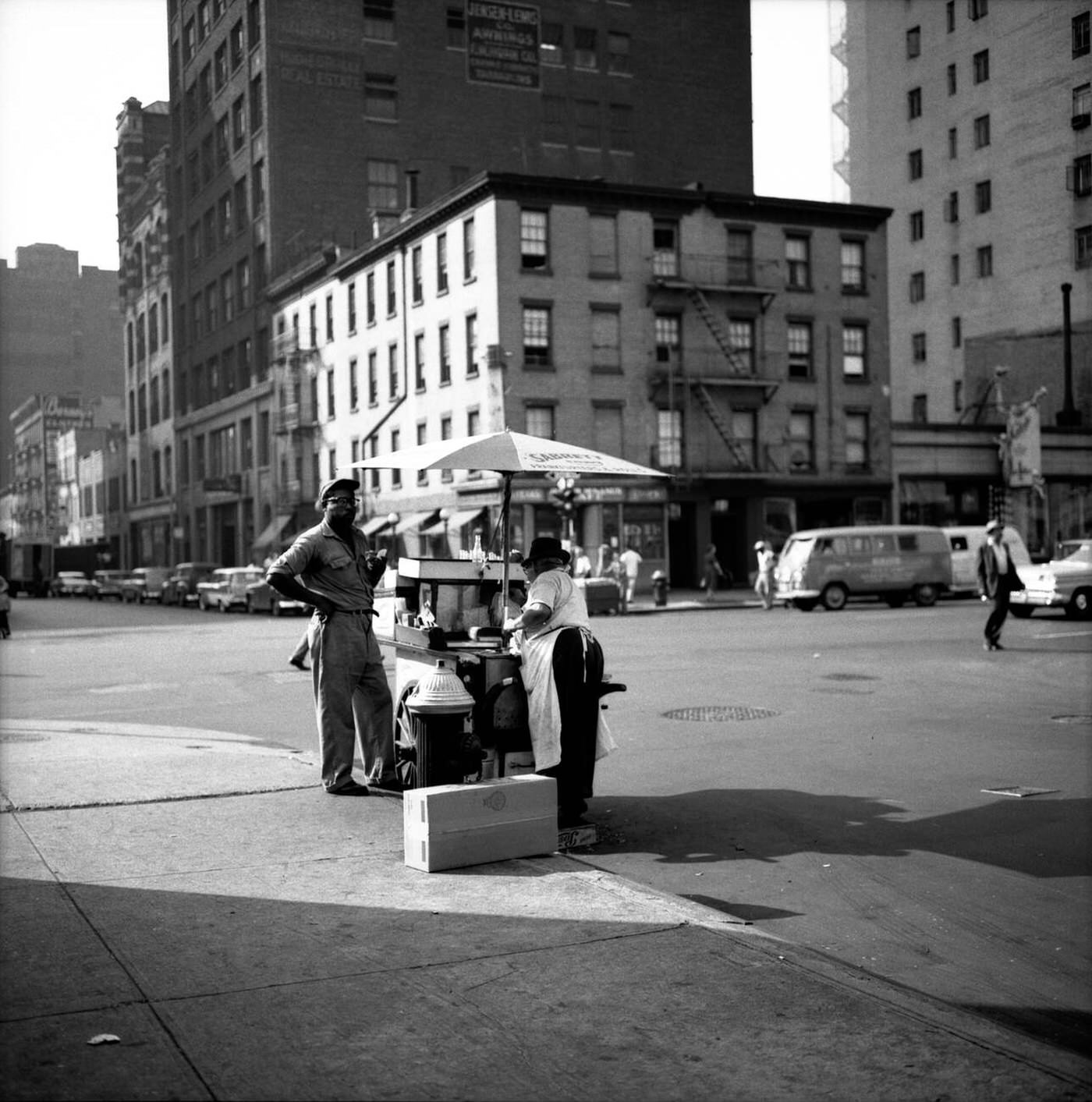 A Working Man Buys A Hot Dog From A New York City Street Vendor, Circa 1960.