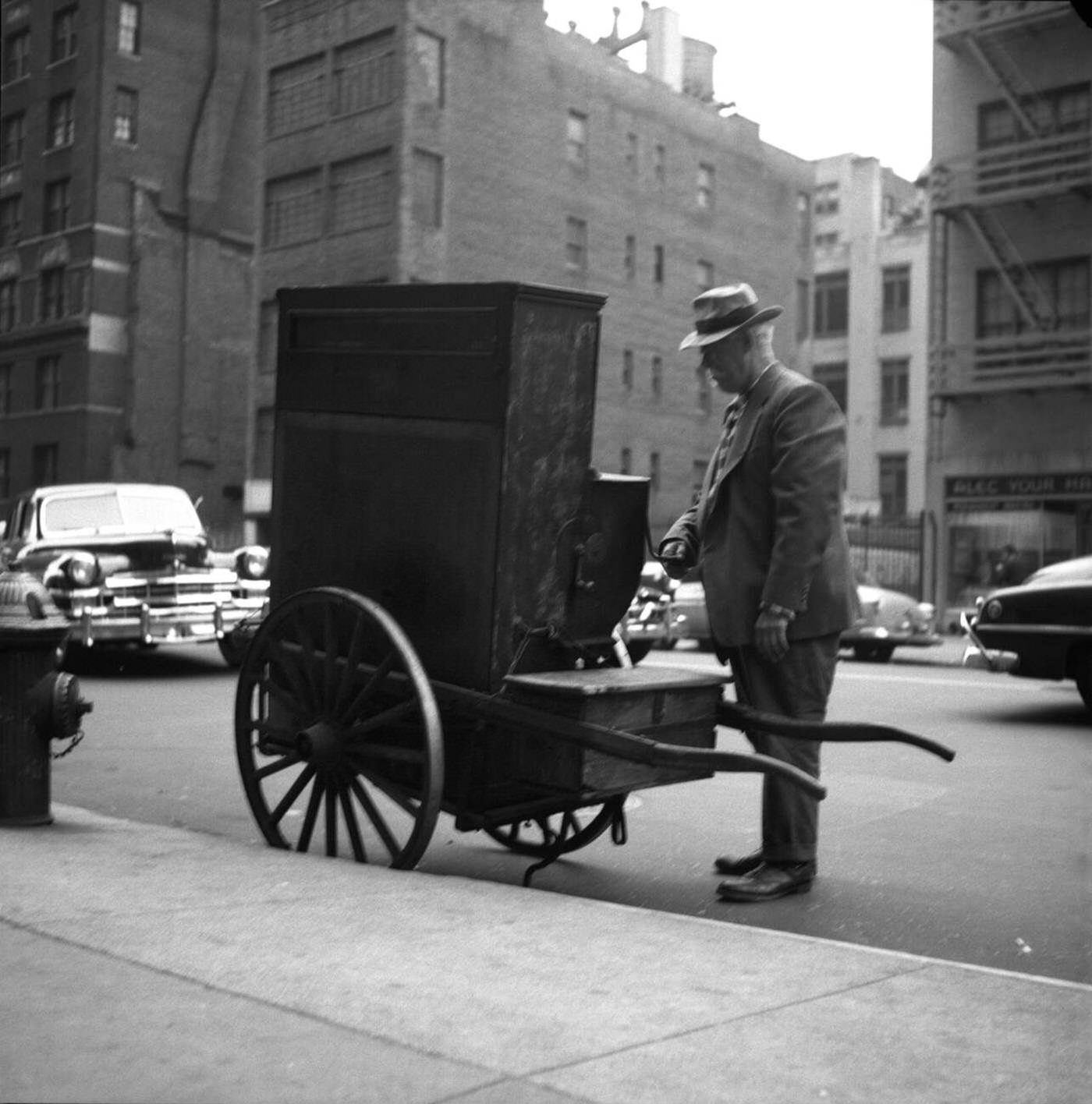 A New York City Organ Grinder On The Street, Circa 1960.