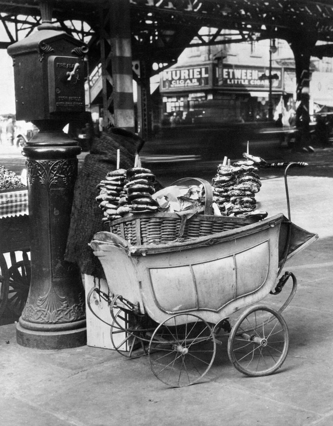 Pretzel Vendor Cart Made From A Baby Carriage Next To A Fire Alarm Box, New York City, 1930S.