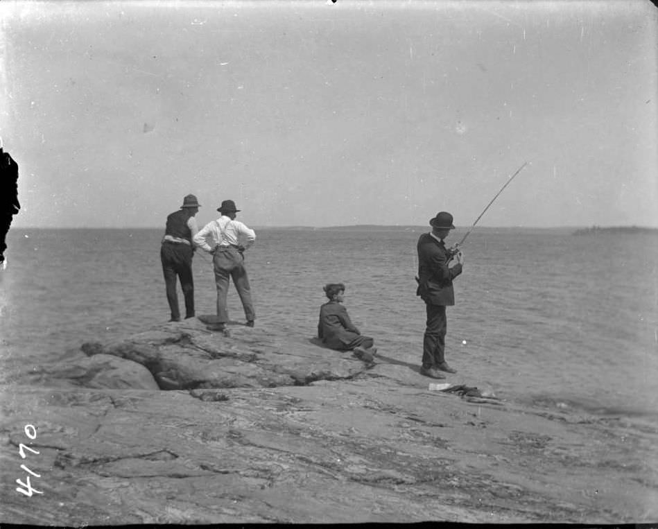 George Stonebridge, Willie, And Two Unidentified Men Fishing Off A Large Rock At Orchard Beach, Bronx, 1907.