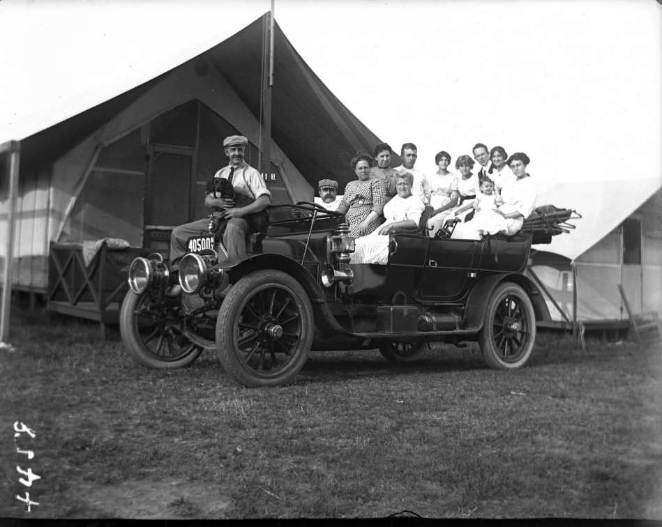 Unidentified Family Crowded Into An Open-Topped Car Outside Camp 11H, Orchard Beach, Bronx, 1912.