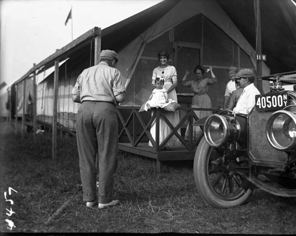 Photographing A Baby Outside Camp 11H, Orchard Beach, Bronx, 1912.