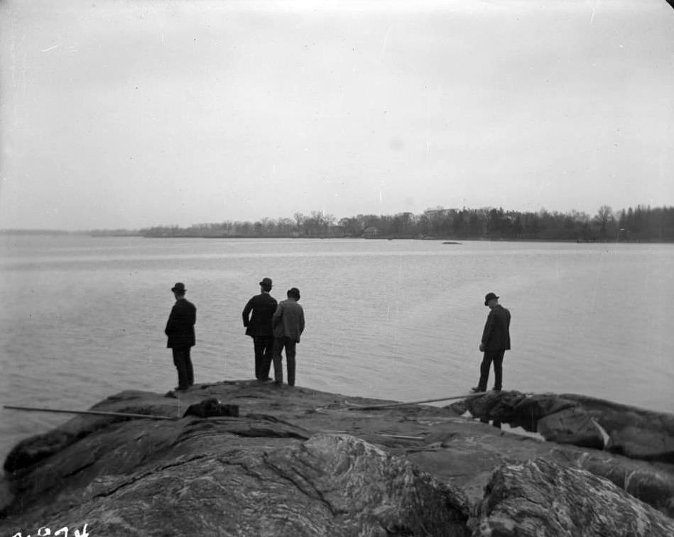 Four Men Fishing Off The Rocks At Pelham Bay Park Or City Island, Bronx, 1900S.
