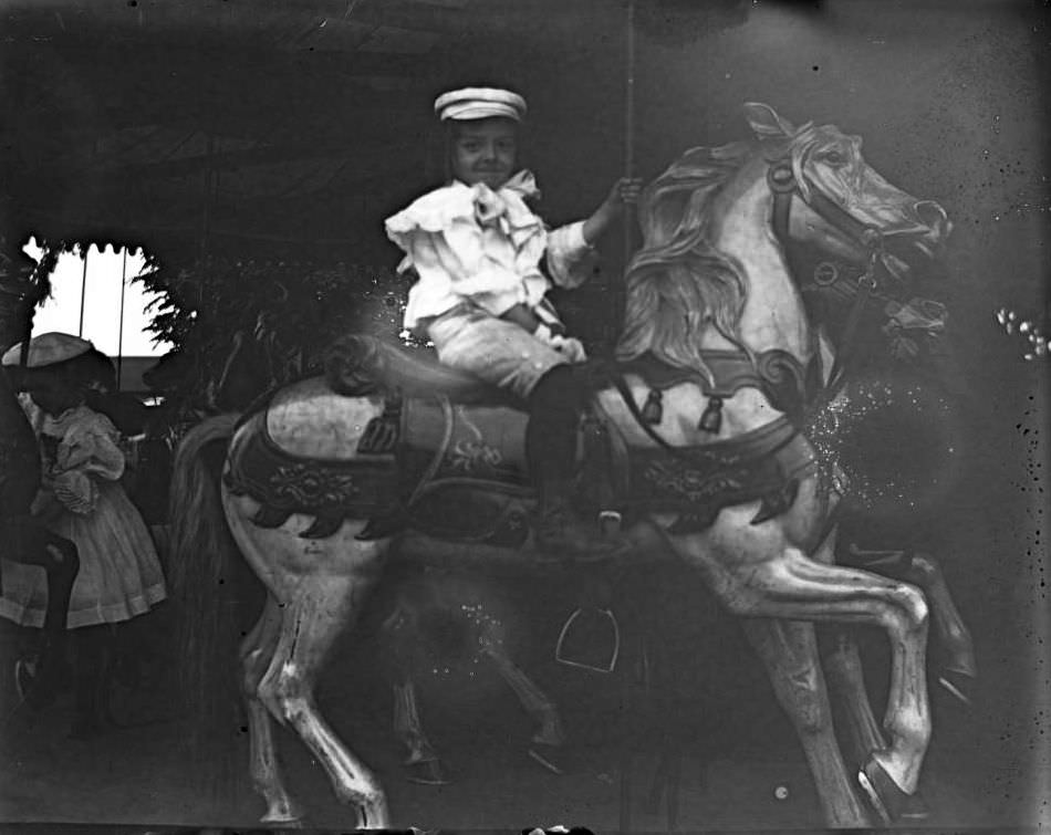 Willie Stonebridge On A Carousel Horse, Lohbauer Park, Throggs Neck, Pelham Bay, Bronx, 1898.