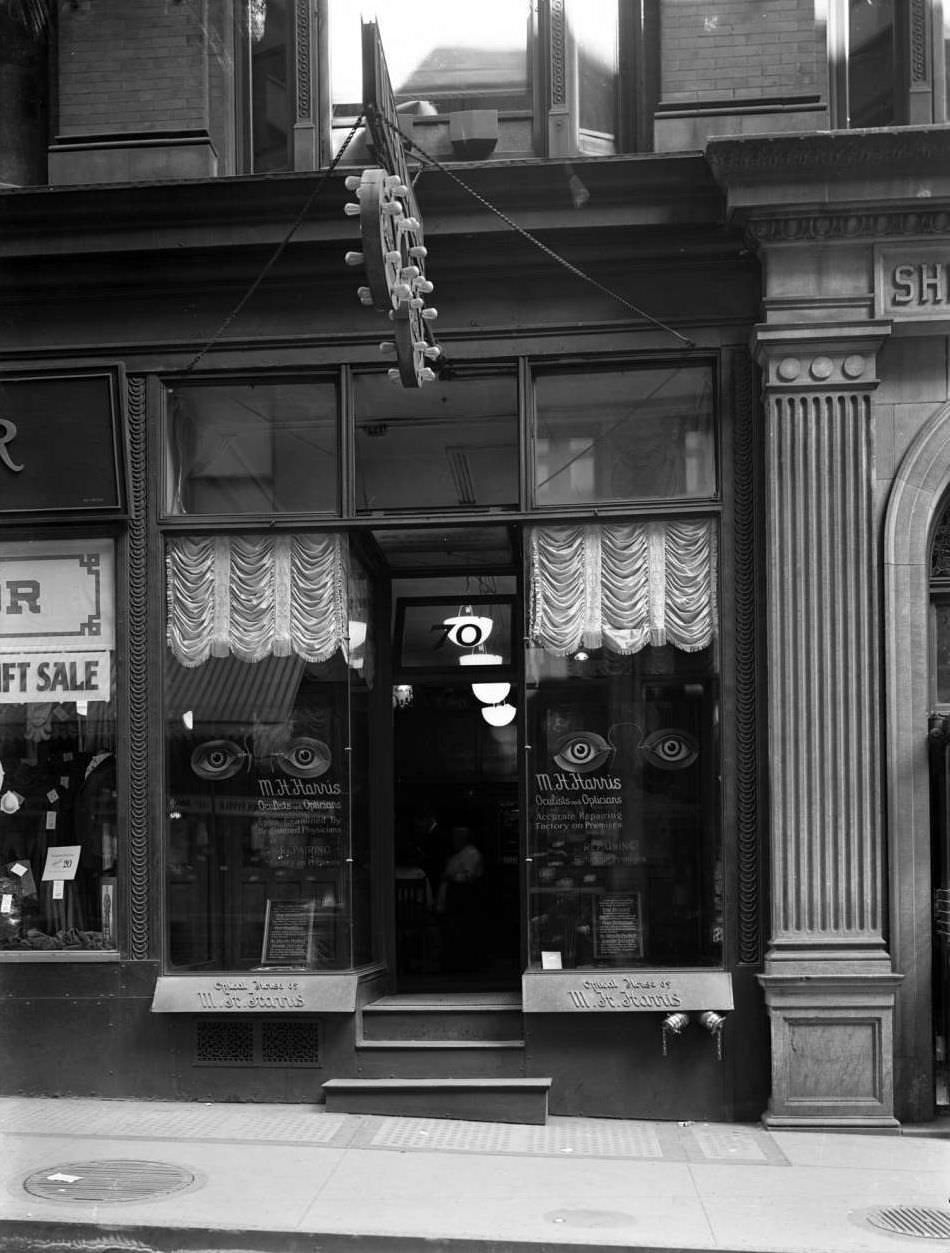 Nassau Street Storefront For M.h. Harris, Oculists And Opticians, Near John Street, Ca. 1918.