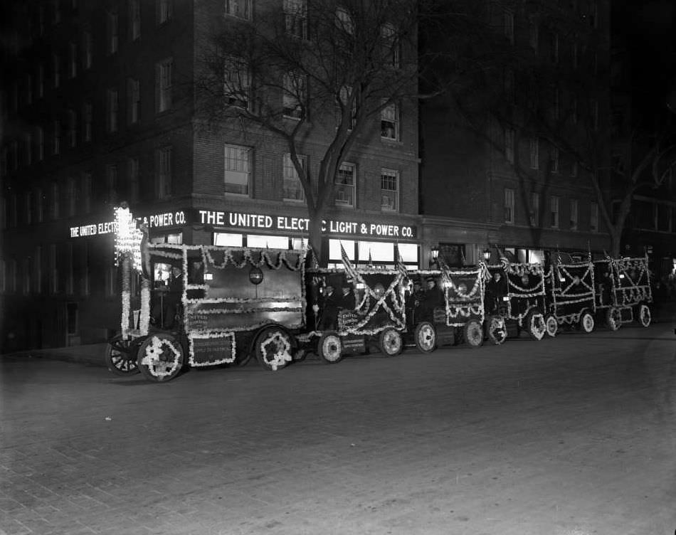 Train Of Decorated Uel&Amp;Amp;Pc Delivery Trucks Outside A Uel&Amp;Amp;Pc Shop, Ca. 1916.